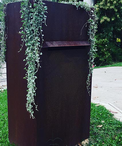 Metal garden art sculptures displayed at village market